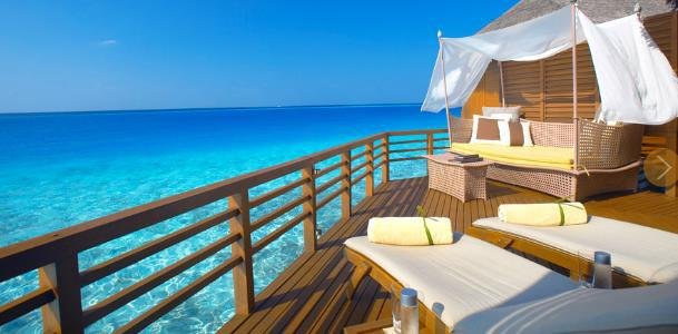 Private timber deck overlooking clear tropical water